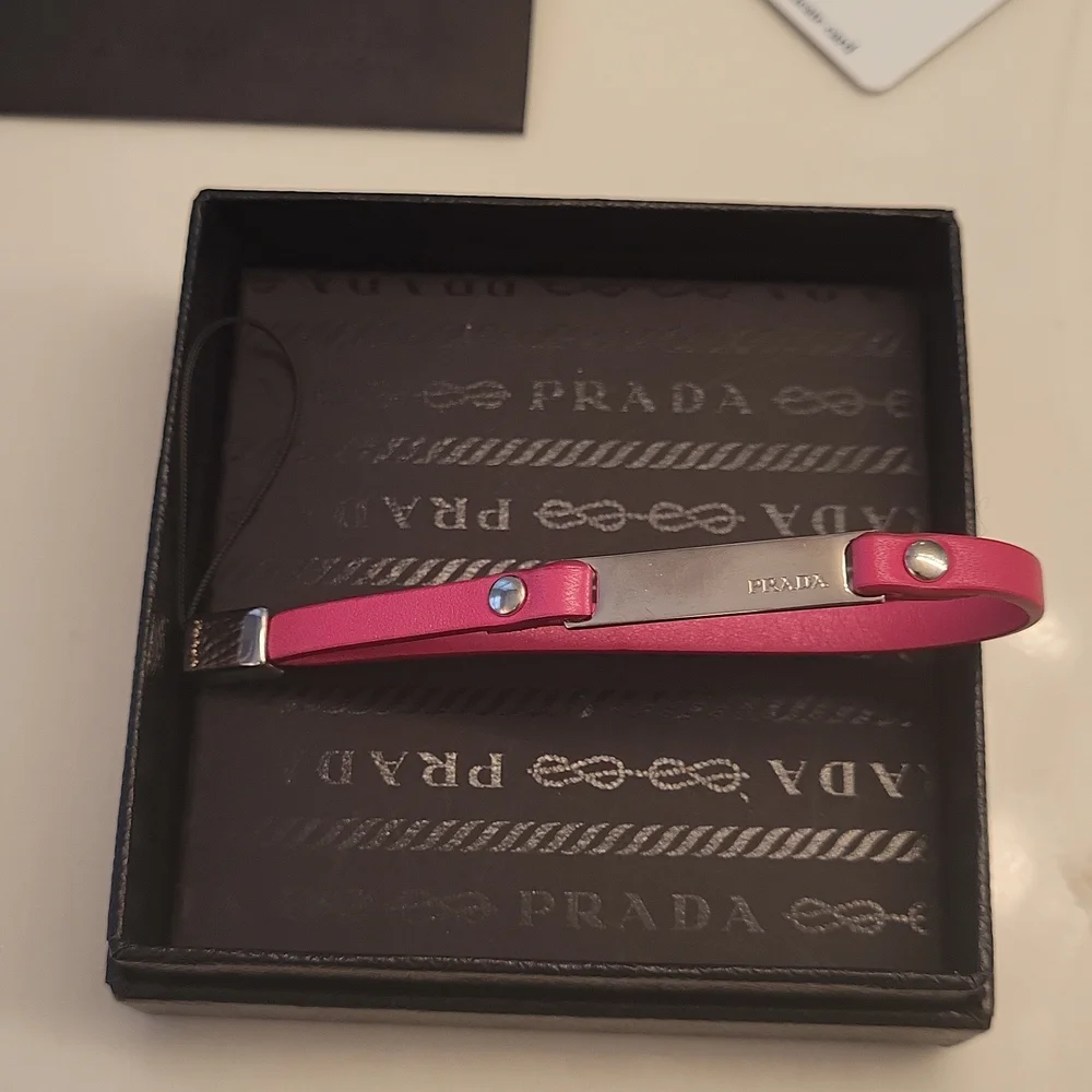 Prada new,keycharm or keyring works both ways boxed card of authenticity new